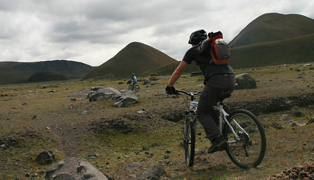 tourist riding a bike on the mountain